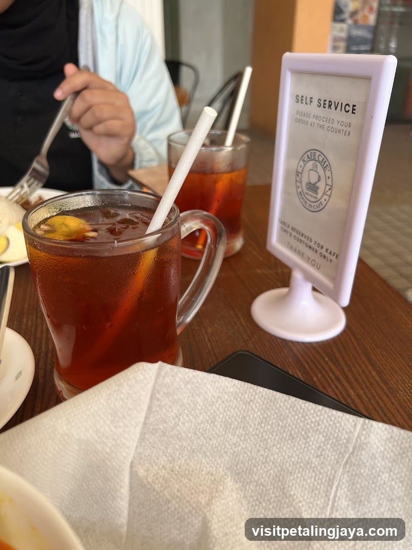 Dining Table with Iced Tea and Self Service Sign