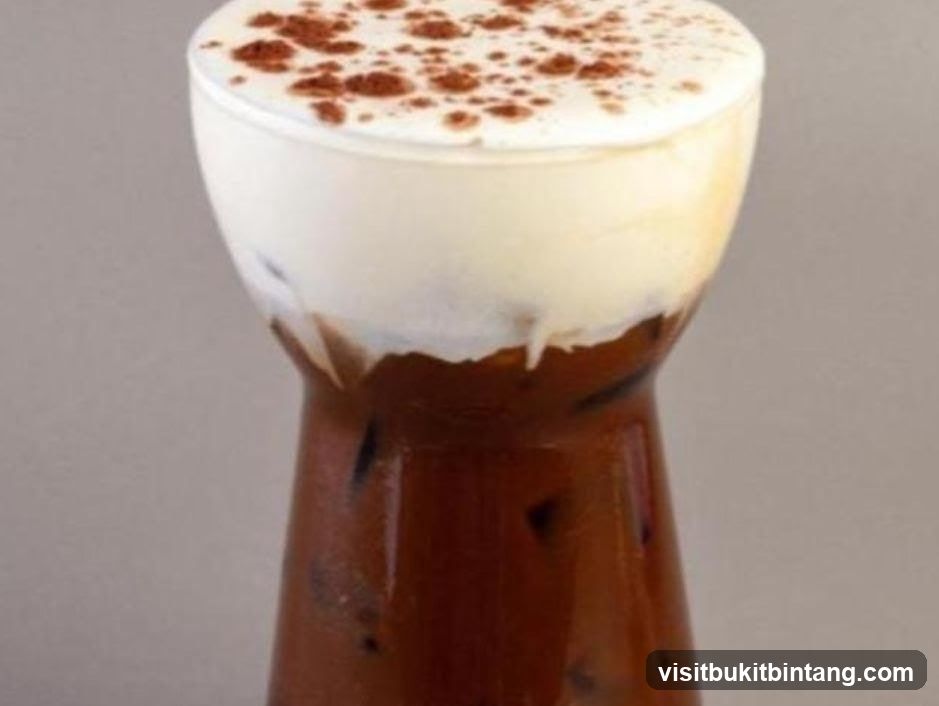 Iced Coffee with Cream and Cocoa Powder