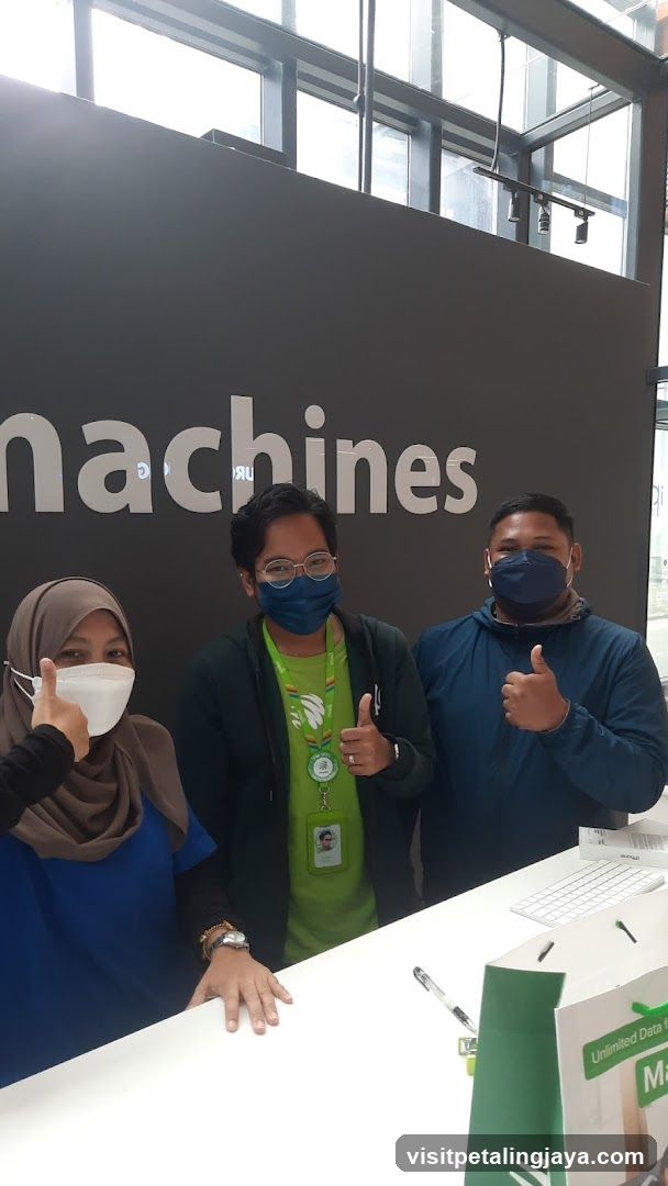 Staff with 'machines' sign