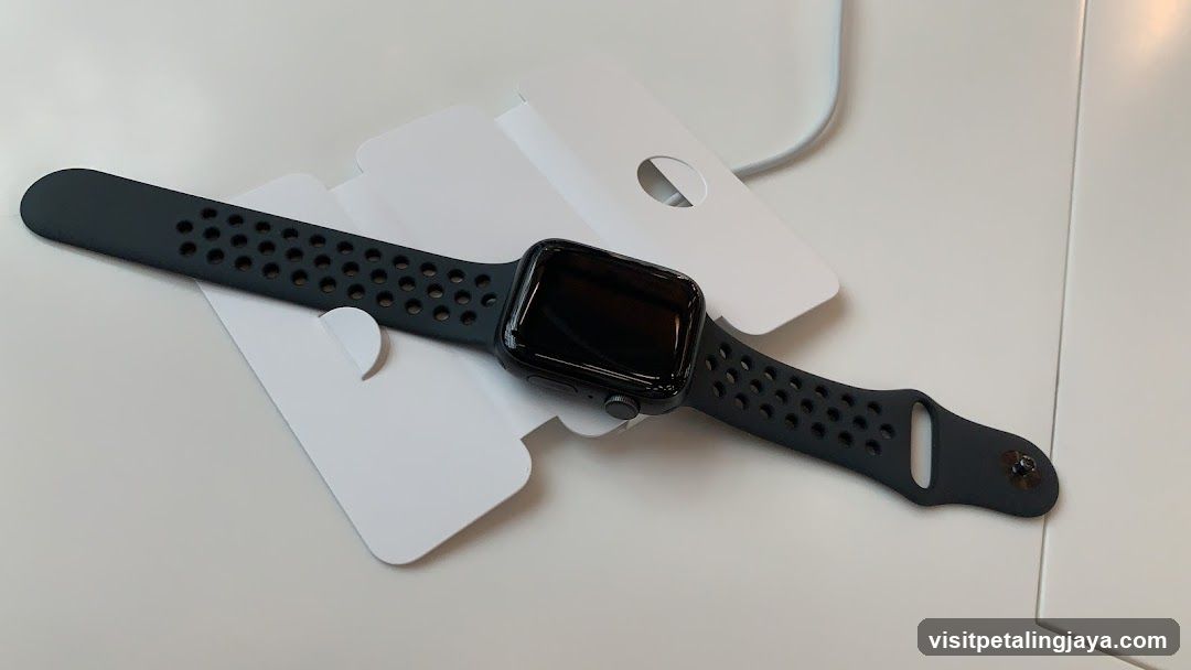 Apple Watch with perforated band on white surface
