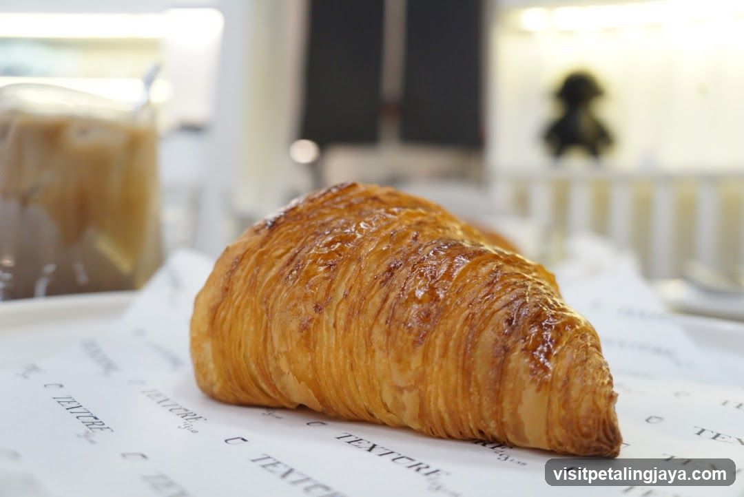 Croissant on printed paper