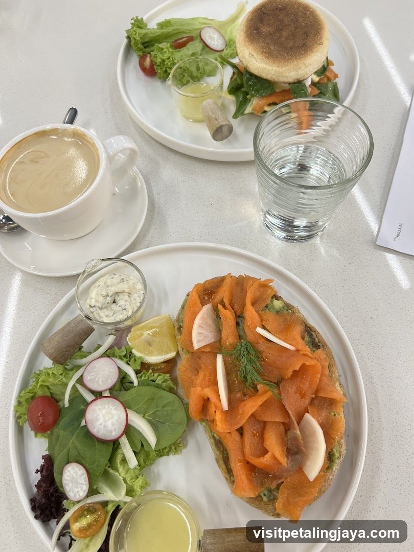 Breakfast Spread with Smoked Salmon Toast and English Muffin Sandwich