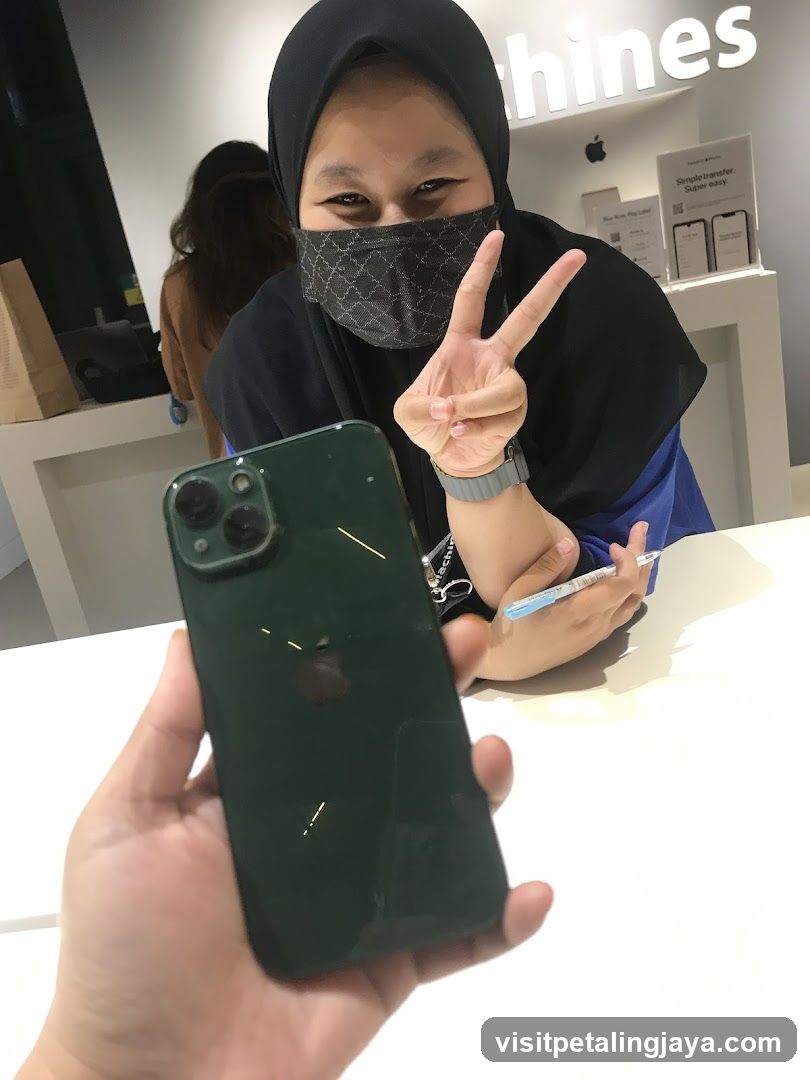 Person holding iPhone in store