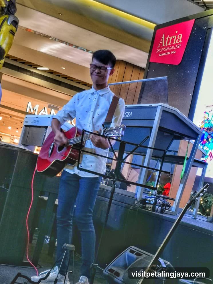 Guitarist performing in shopping mall