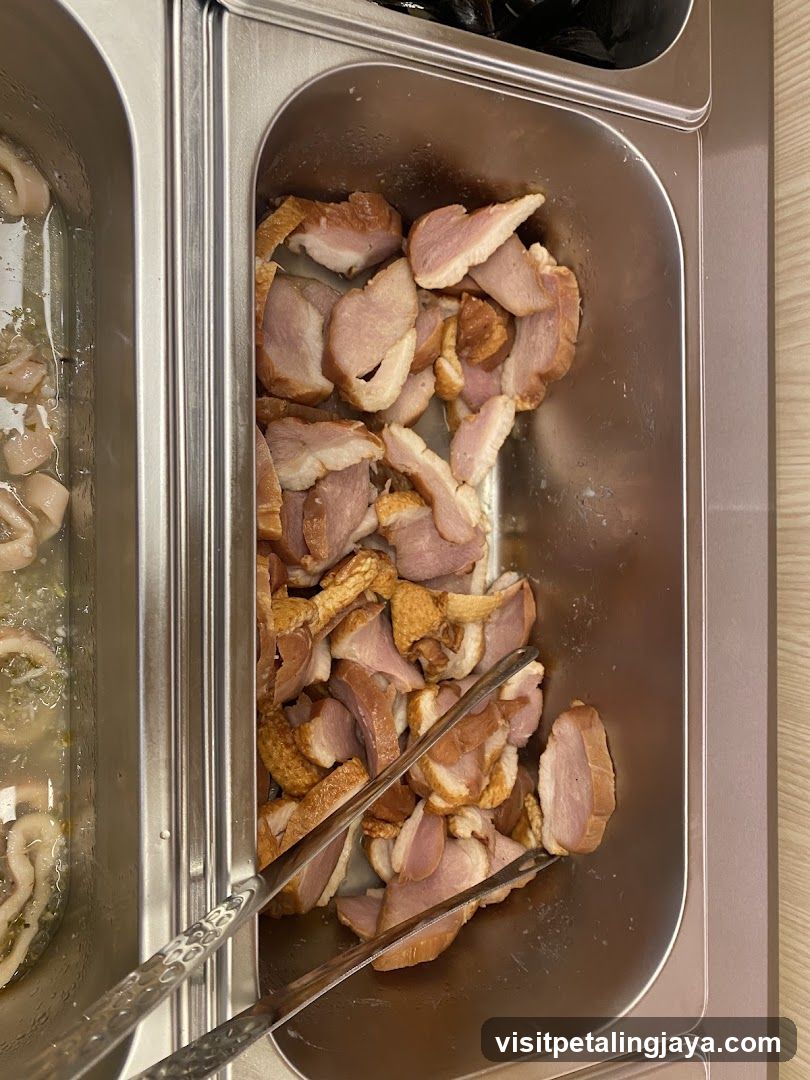Food Tray with Sliced Meat and Tongs