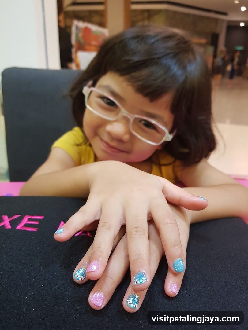 Child with Glitter Nail Art