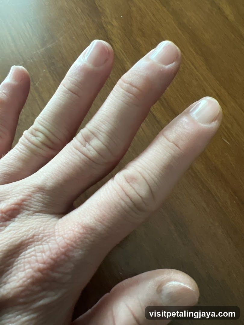 Hand on wooden surface