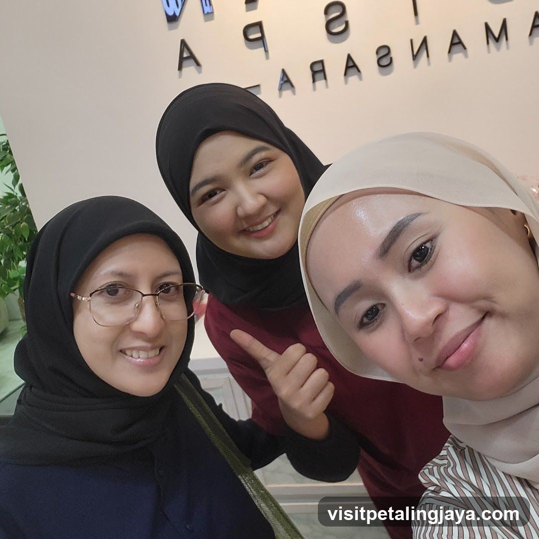 Three women in hijab posing indoors