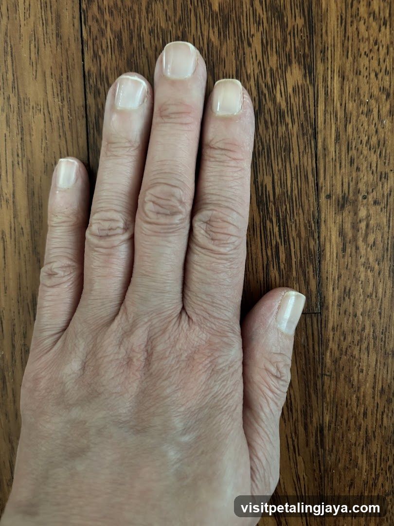 Hand on wooden surface
