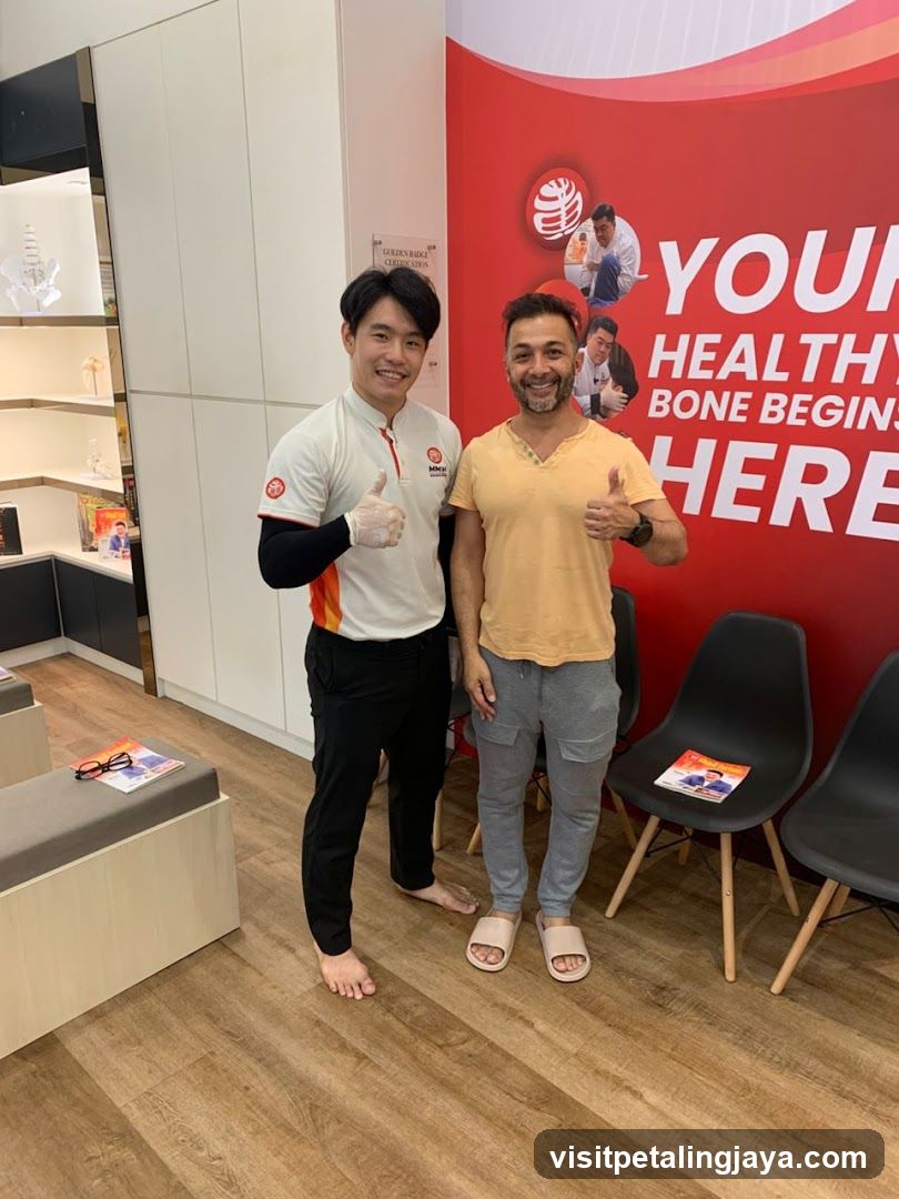 Two men giving thumbs up in a clinic or wellness center