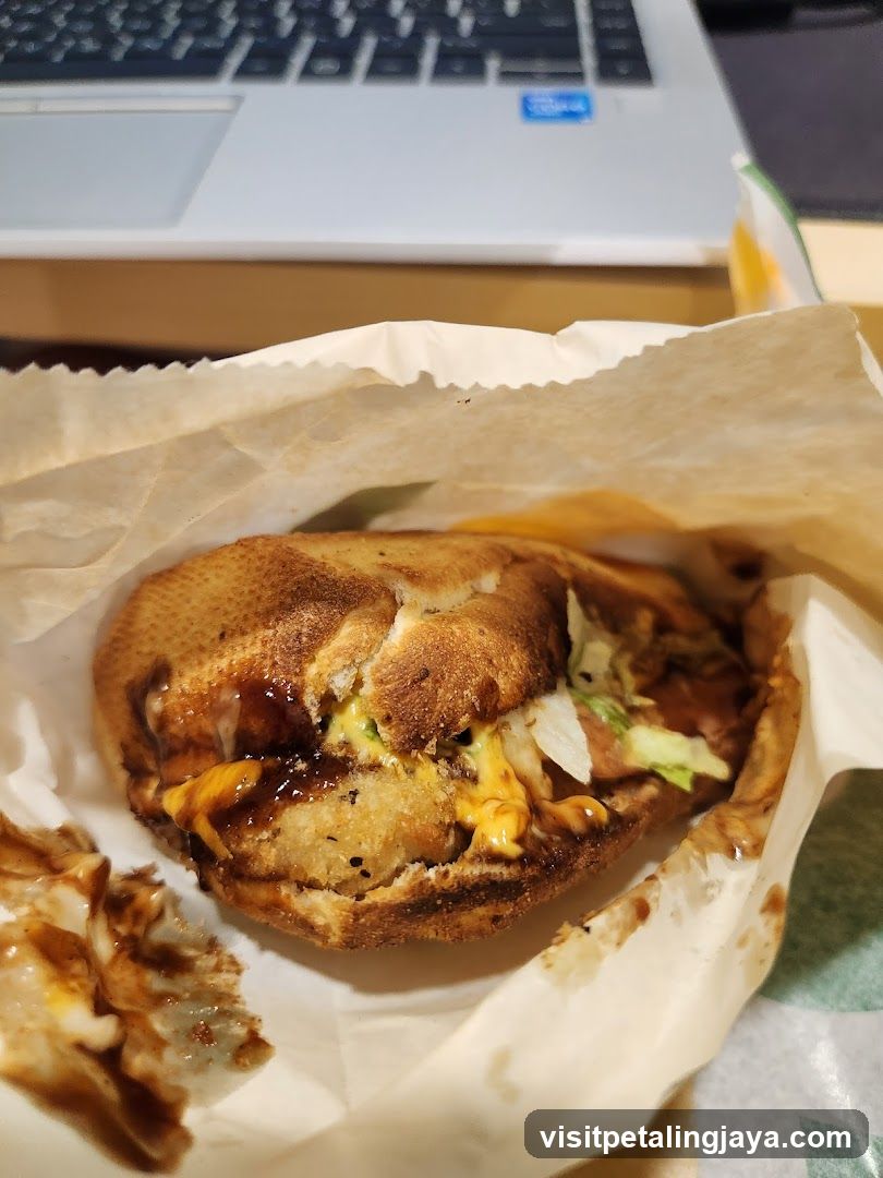 Eaten Sandwich with Laptop in Background