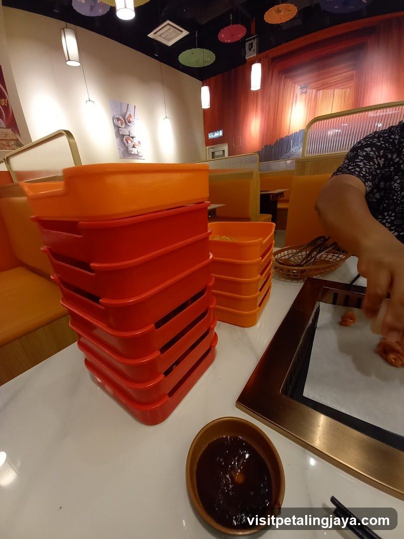 Dining Table with Orange Containers and Sauce Bowl