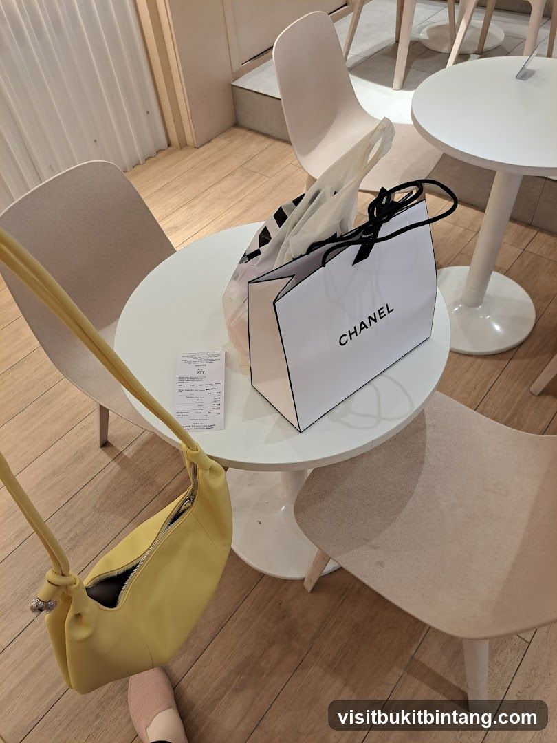 Chanel Shopping Bag and Receipt on Table