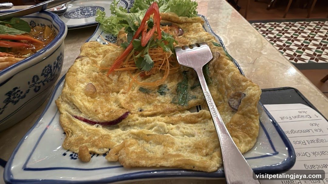 Omelette with garnish and side dish