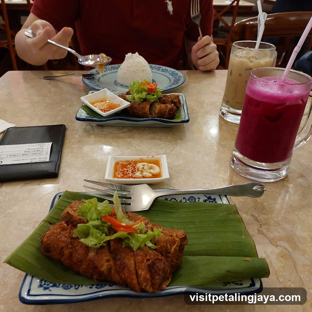 Food Table with Spring Rolls and Drinks