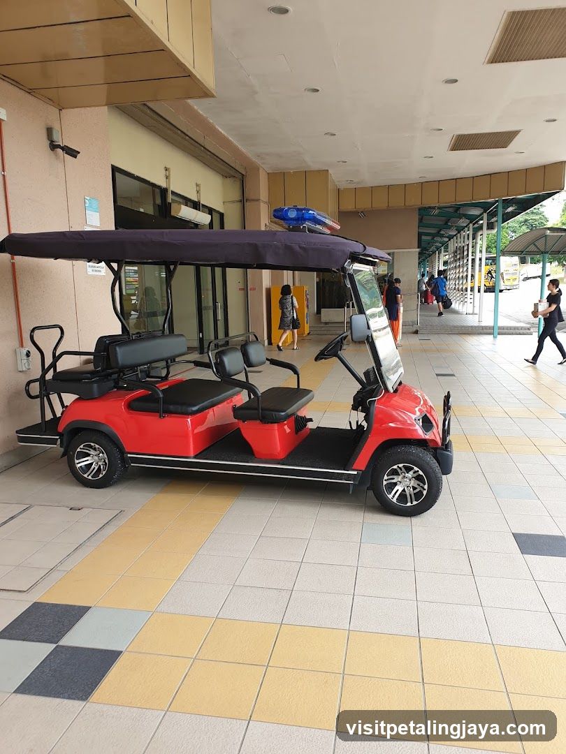 Red Shuttle Vehicle at Entrance