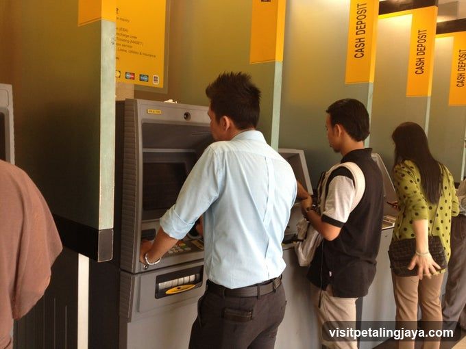 People at ATMs