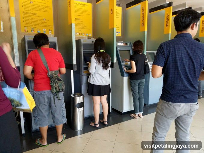 People at ATMs