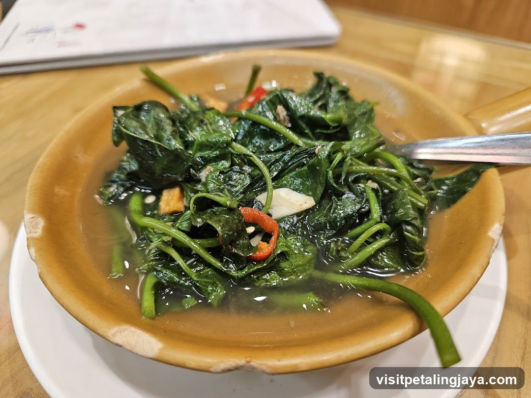 Bowl of stir-fried greens with chili and garlic
