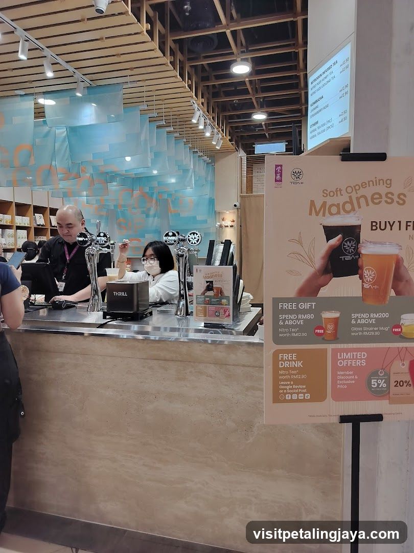 Coffee Shop Interior with Staff and Promotional Signage