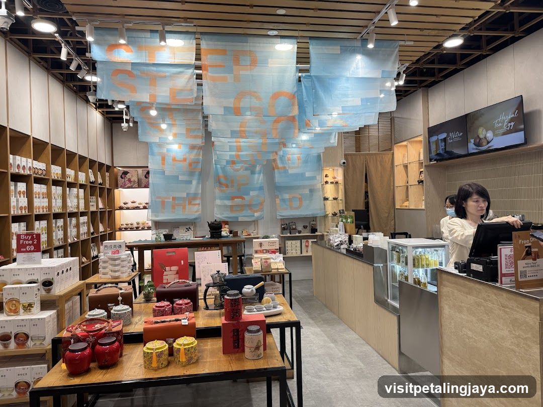 Interior of a tea shop with hanging banners and product displays
