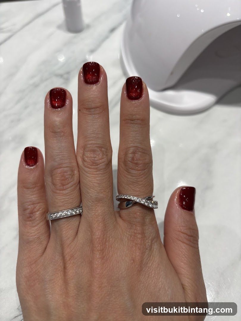 Woman's Hands with Red Nails and Rings