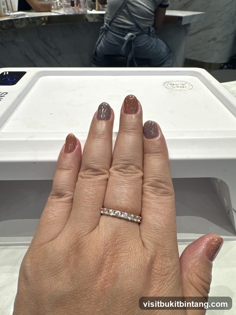 Hand with freshly painted nails