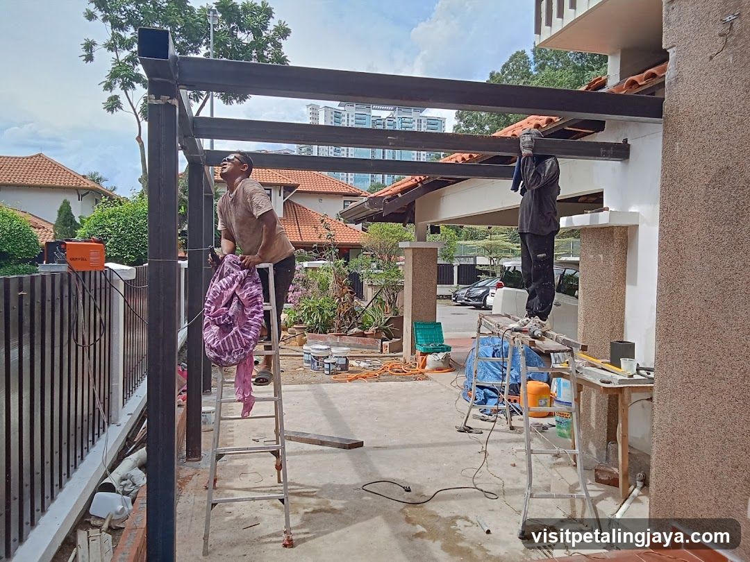 Construction Site with Workers on Ladders