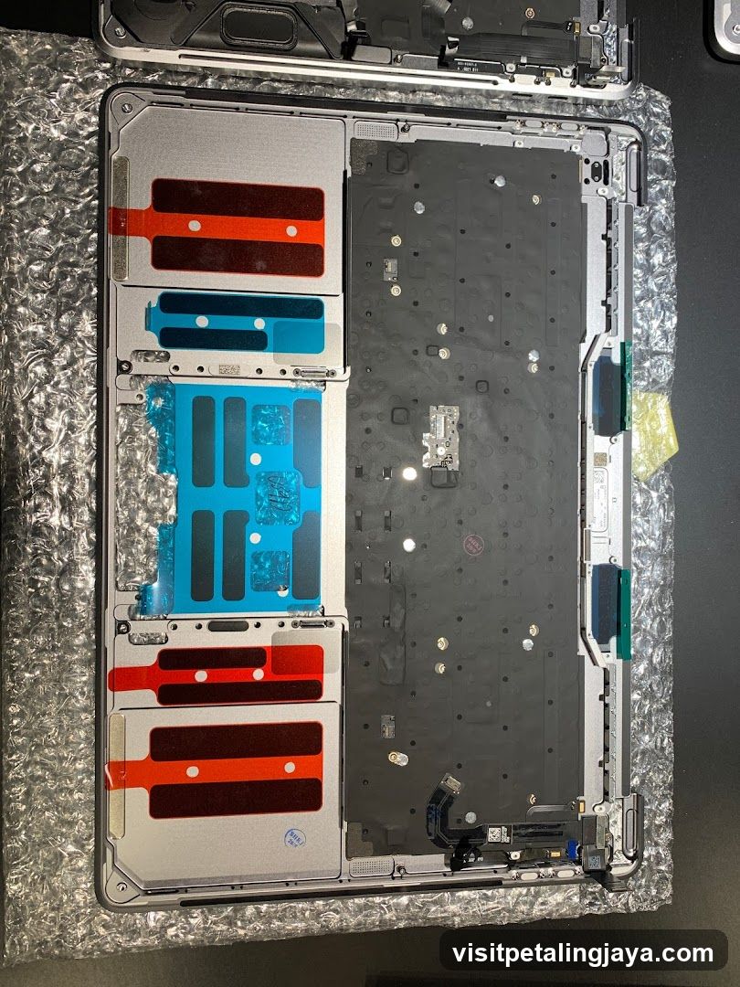 Disassembled Laptop Chassis with Thermal Pads