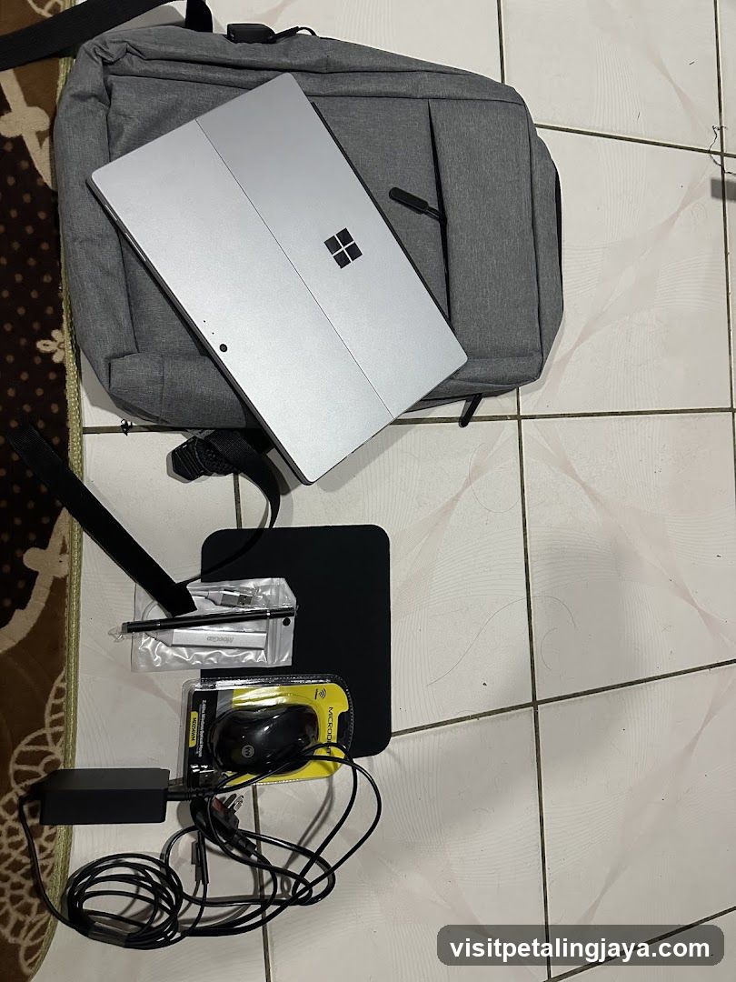 Laptop and Accessories on Floor
