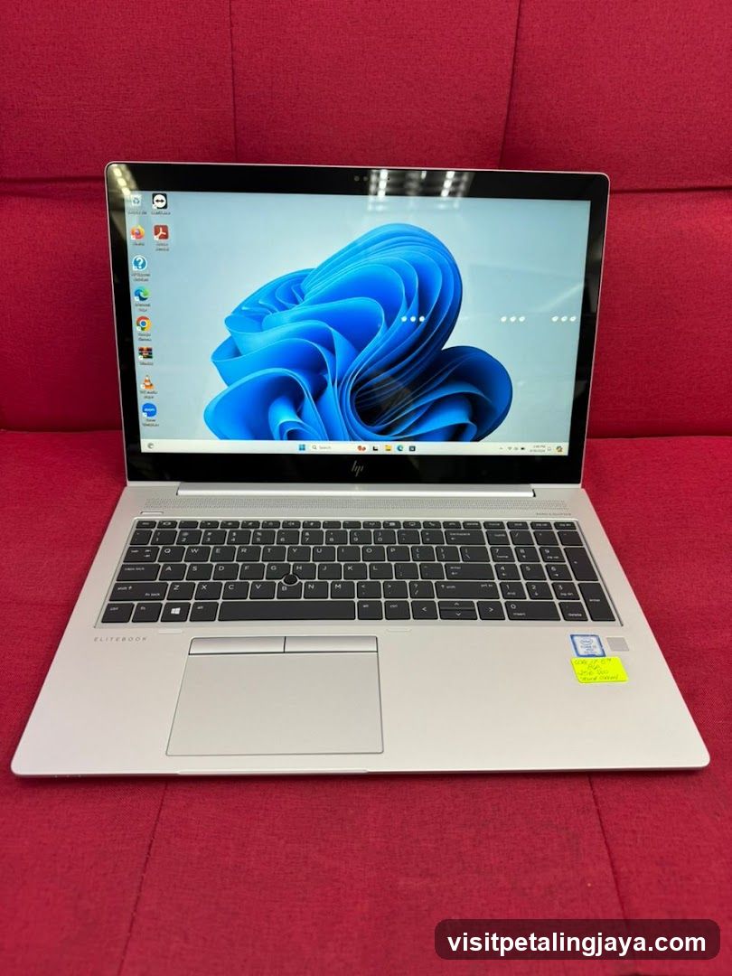 HP EliteBook Laptop on Red Sofa