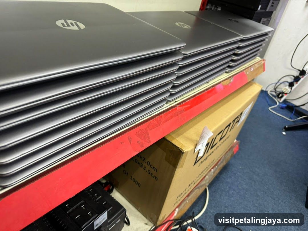 Stack of HP Laptops on Shelf