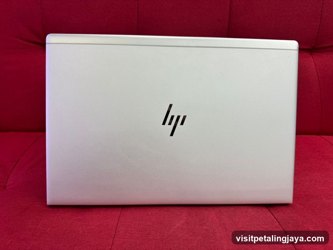 HP Laptop on Red Background