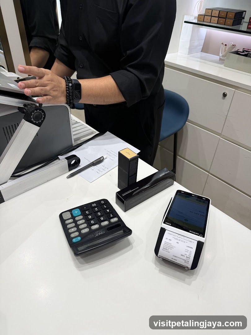 Checkout Counter with POS Terminal and Calculator