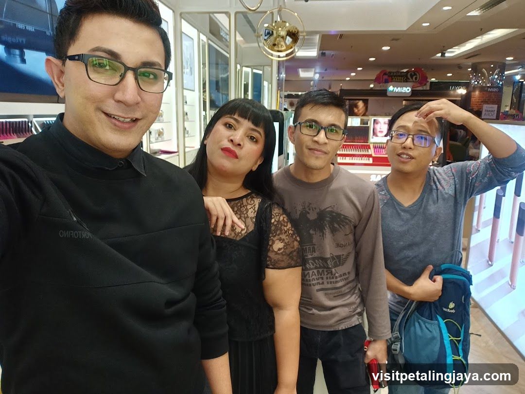 Group selfie in cosmetics store