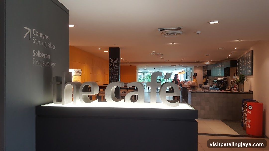 Cafe Interior with Signage and Staff