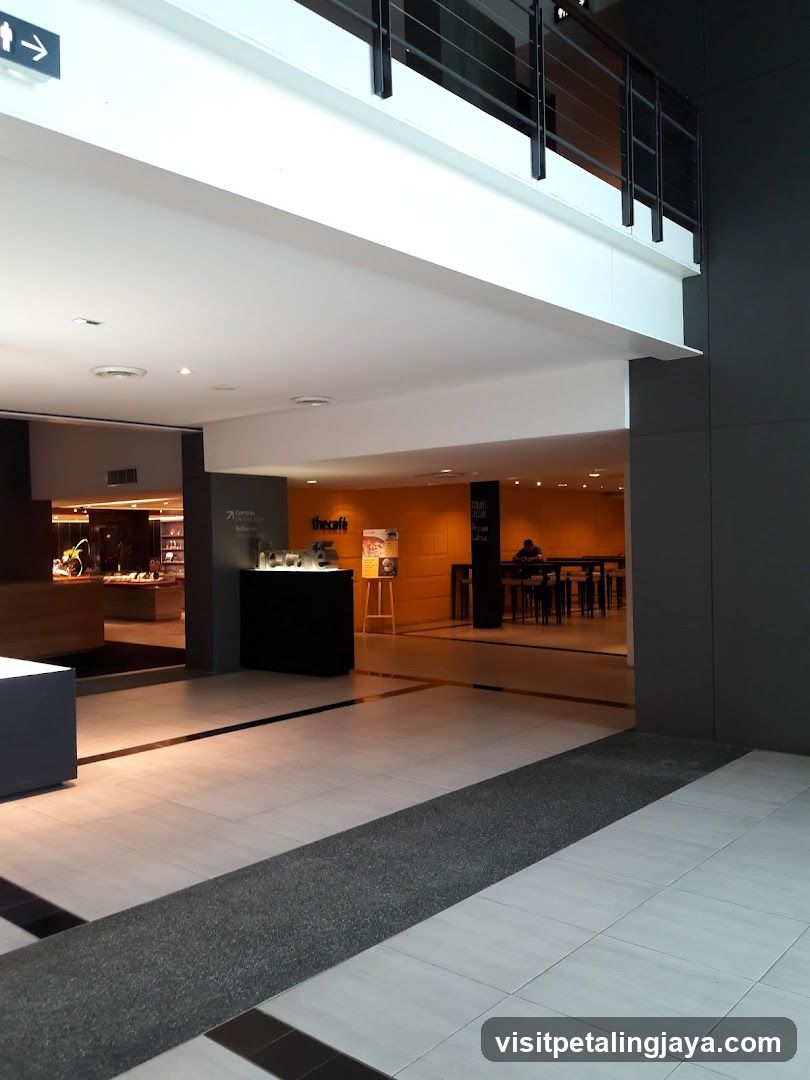 Interior of a modern building lobby with cafe area