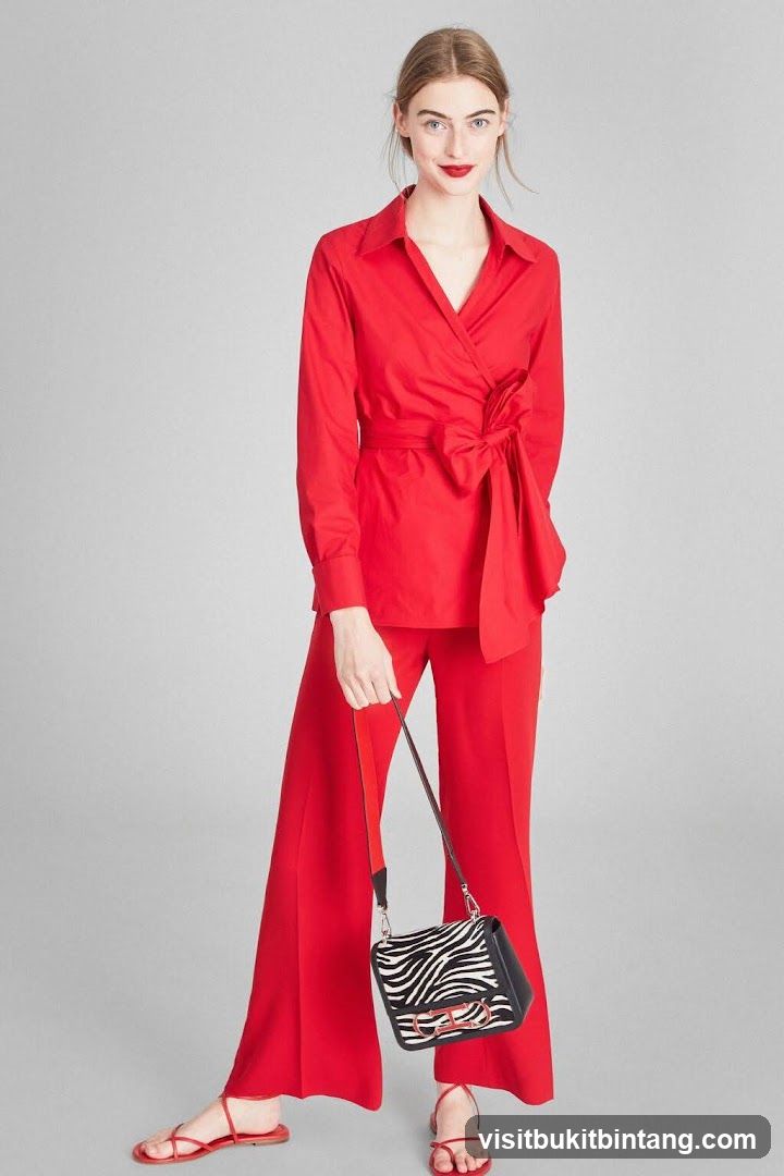 Woman in Red Outfit with Zebra Print Bag