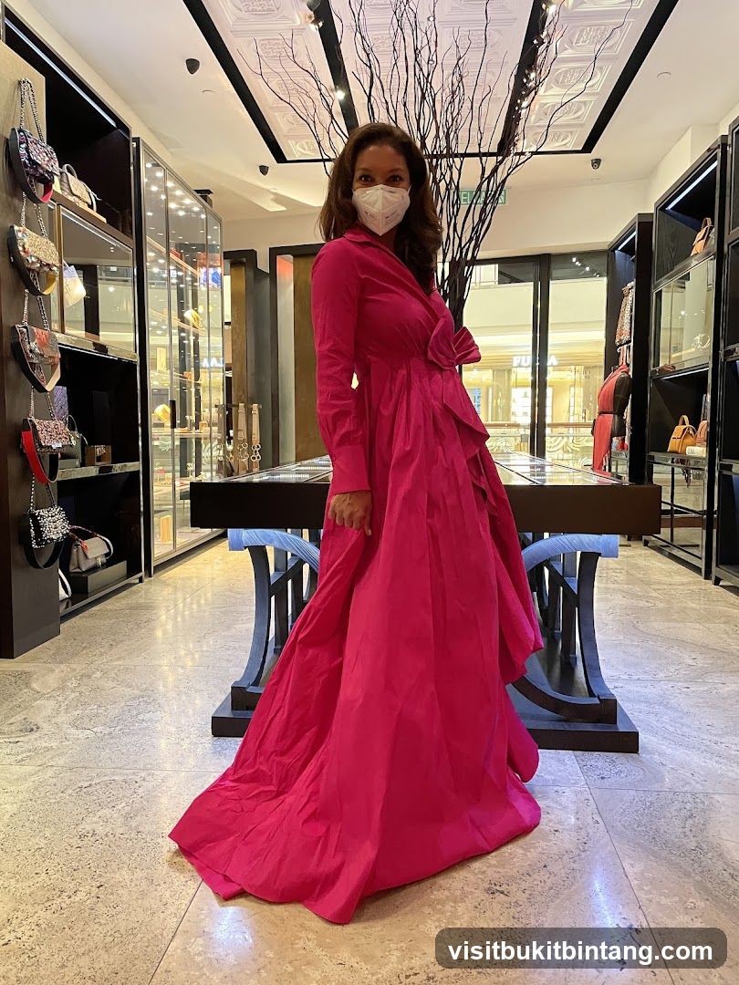 Woman in Pink Dress in Store