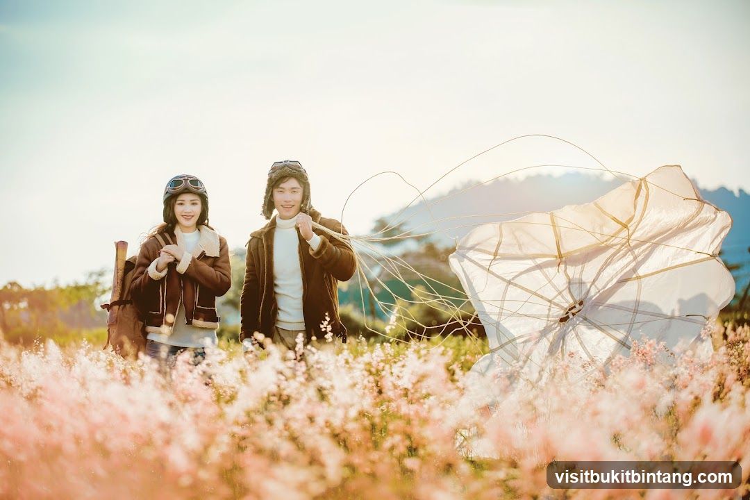 Couple in Aviator Outfits with Parachute