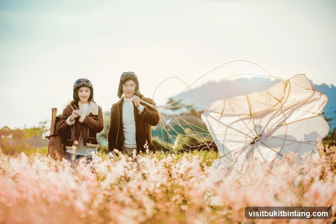 Couple in Aviator Outfits with Parachute