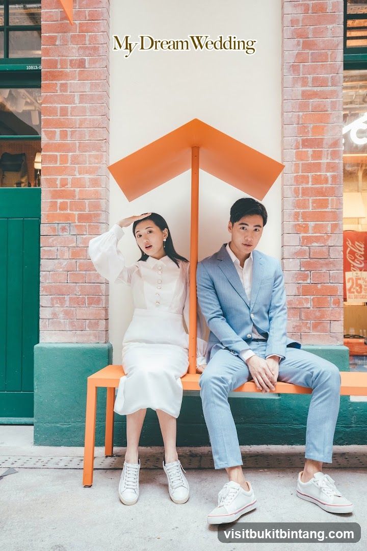Couple Posing Under Orange Structure