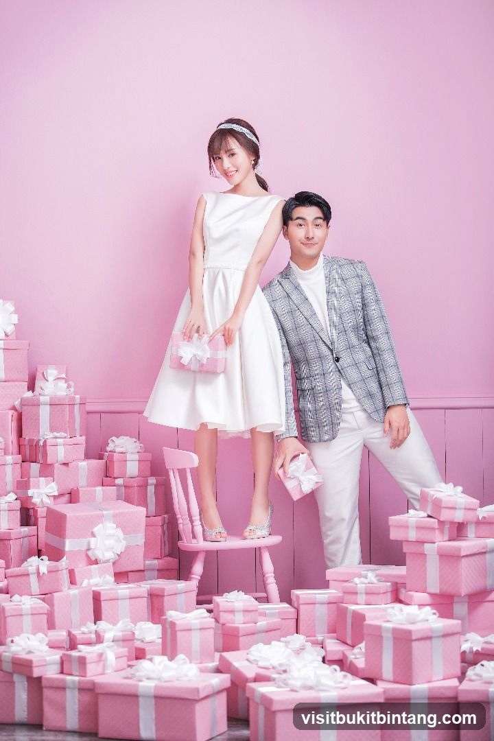 Couple Posing with Pink Gift Boxes