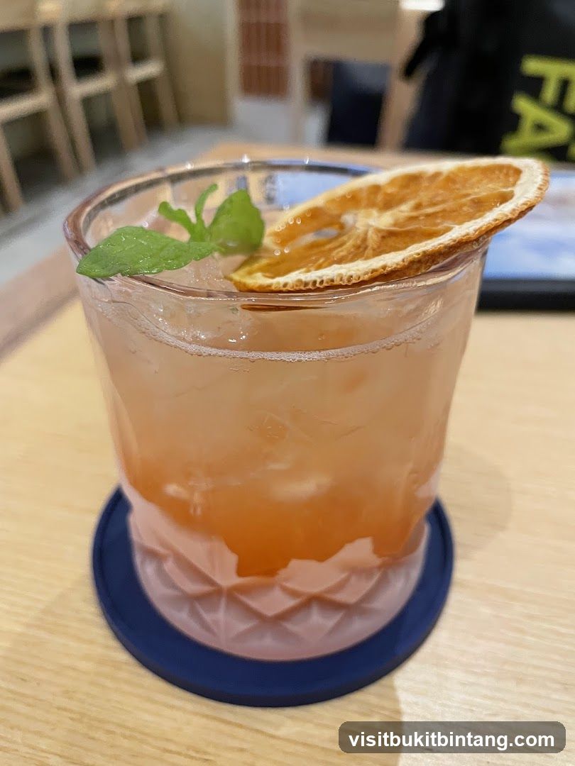 Cocktail with Orange Slice and Mint