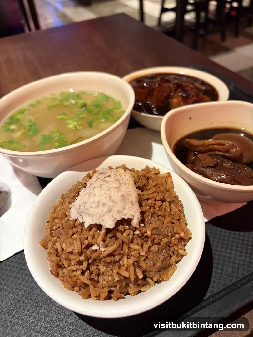 A meal with rice, soup, and braised dishes