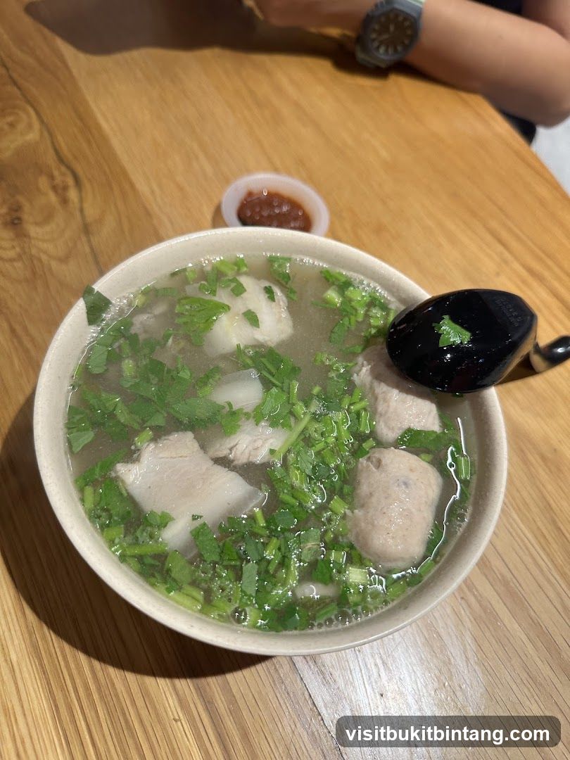 Bowl of Soup with Meatballs and Pork Slices