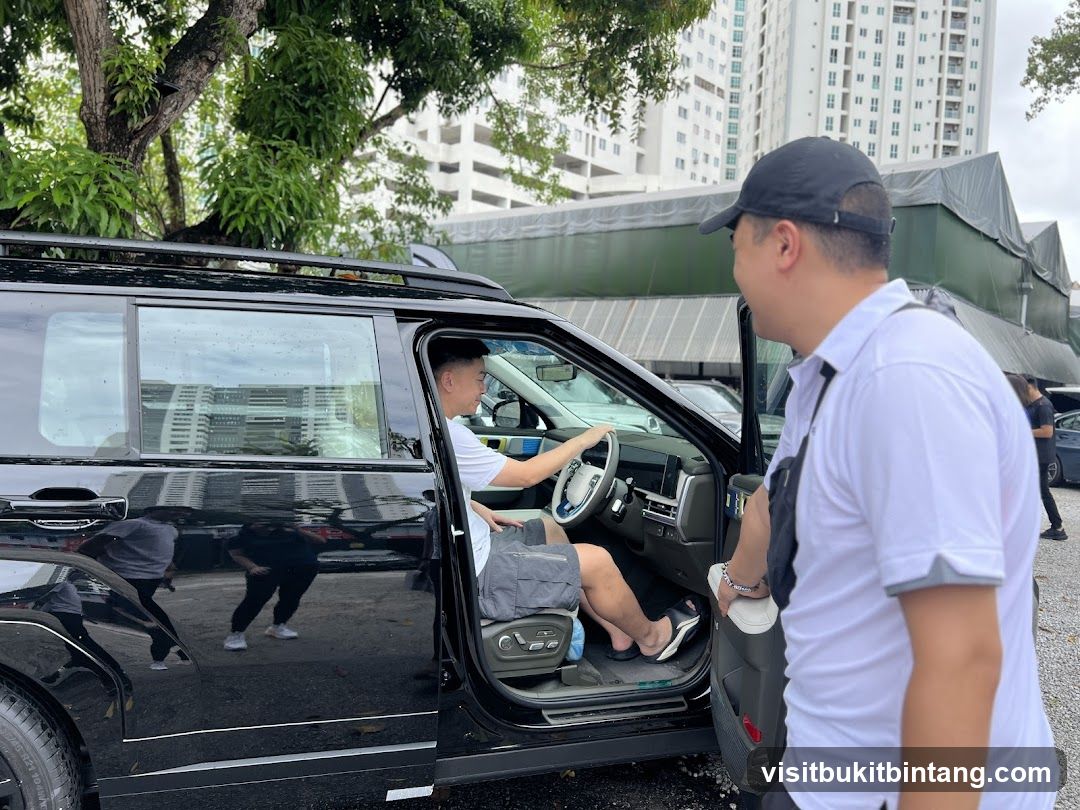 Two men by a car