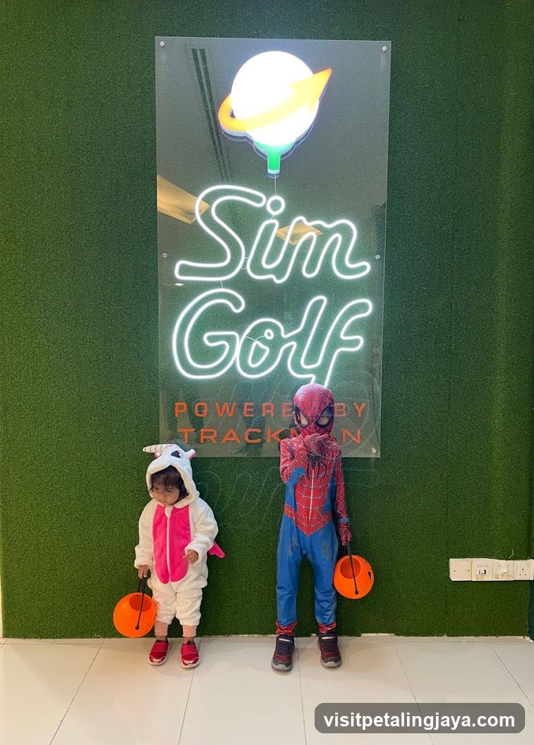 Kids in costumes at Sim Golf entrance