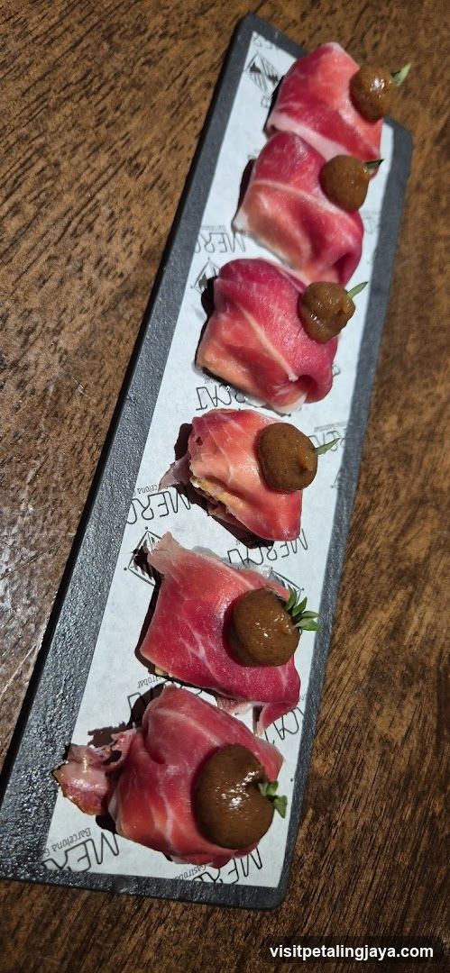 Sliced Meat with Olives on Slate Platter