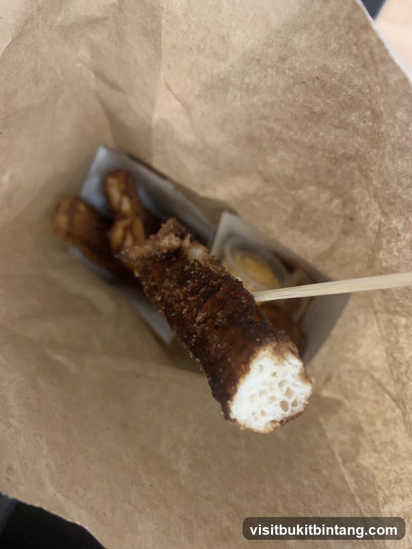 Churros in a paper bag